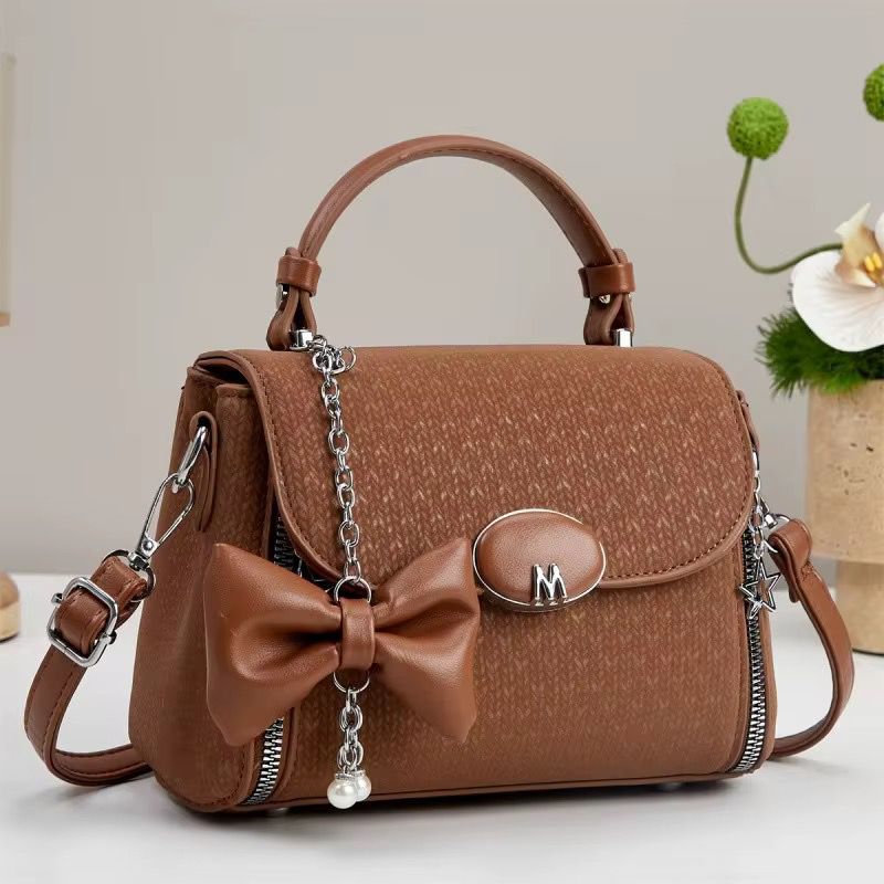 Sac à main avec bandoulière simple et fermeture à glissière